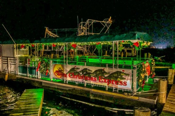 a green boat on a river